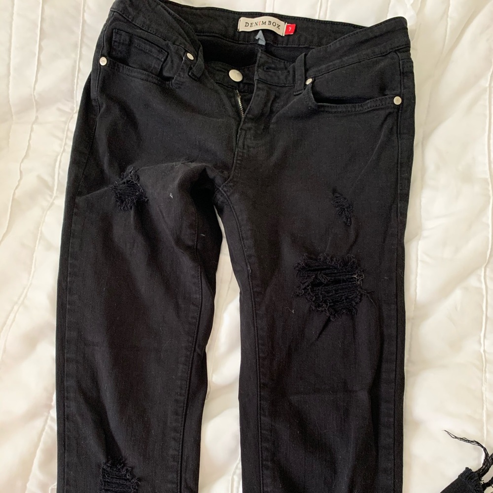 Distressed black denim jeans